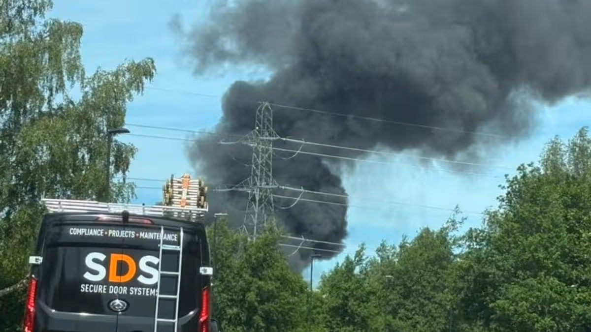 Oldham fire live: Smoke fills sky over M60 as firefighters warn ‘stay away’